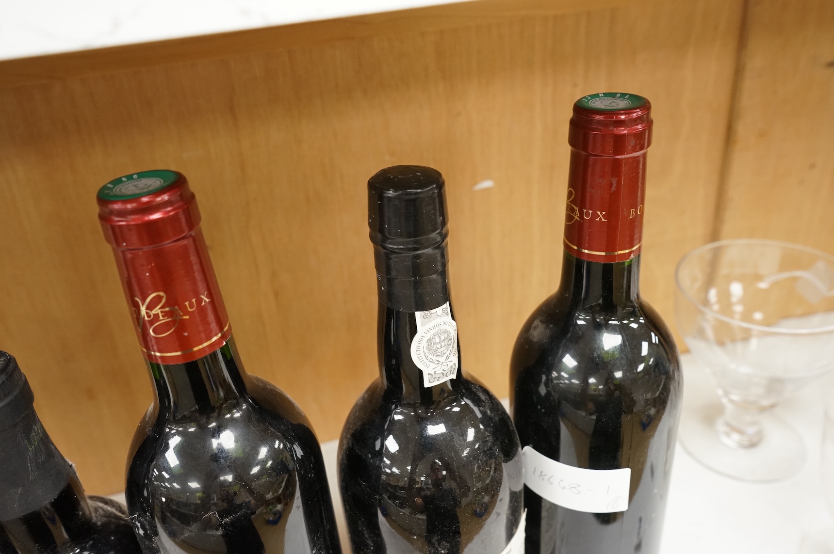 Two bottles of Warres 1988 vintage Port, a half bottle of Taylor's 1997, a Taylor's 10 year old Port, and two bottles of Chateau Lartigue, 2004
